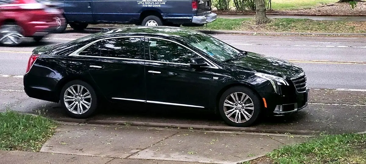 Black Cadillac XTS executive sedan